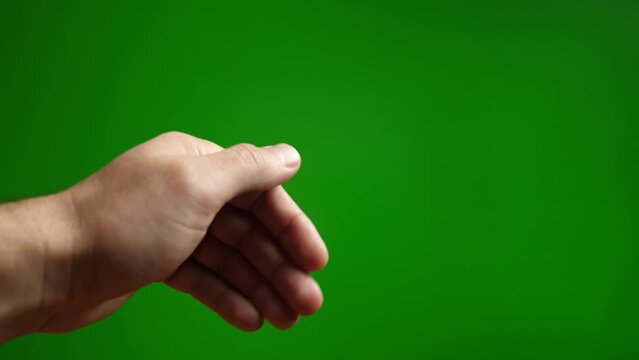 Palm gesture to move away, go away on green background.