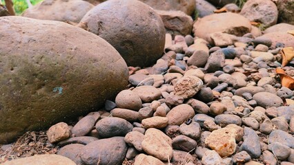 Pebble texture or gravel background for design. Real grunge texture background and small stones. Top view of dirt gravel road.