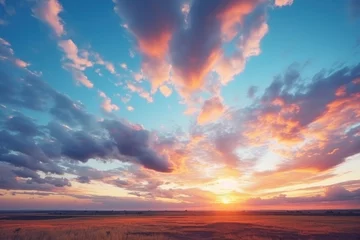 Wandaufkleber Majestic sunrise or sunset landscape with stunning nature's light and rolling colorful clouds. © Wararat