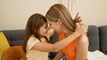 A loving mother and daughter hug tightly, sharing a joyful moment together in a cozy living room setting.