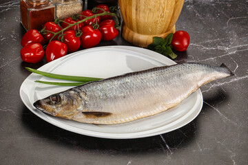 Whole raw salted herring fish