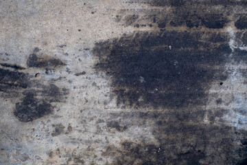 Car oil stains dripping onto cement floor, car engine oil, cement floor, dirt, old, top view,