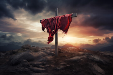 A christian cross with a red cloth, on top of the mountain against sunset light and cloudy sky in a dramatic scenery. Fosus on the crooss - obrazy, fototapety, plakaty
