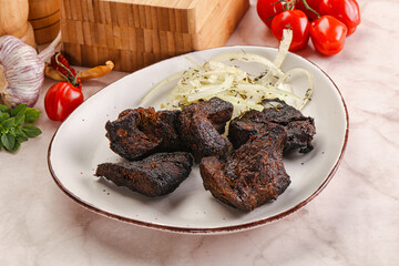 Grilled beef barbecue served onion