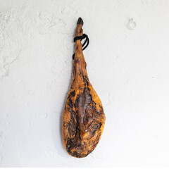 Piece of black leg Iberian ham hanging, spanish food