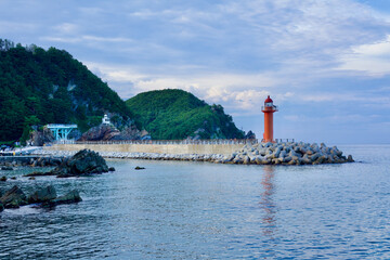 Fototapeta na wymiar Simgok Port Breakwater with Lighthouse and Sea Fan Road View
