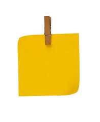 yellow note paper with wood clip isolated