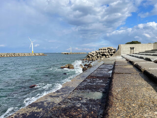 Fototapeta na wymiar Offshore wind turbines on the coast of Toyama Bay in Japan