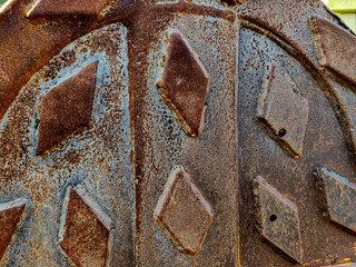 Rusty steel plate with cross-hatch non-slip texture pattern