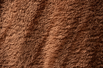 Texture of a brown faux fur as a background.
