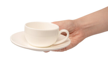 Female hand holding coffee cup and saucer isolated on white background.