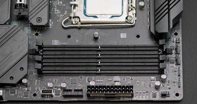 Installing the RAM module into the slot on the computer's motherboard. Assembling a personal computer