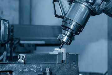 The angular milling process on NC milling machine with flat end mill tools.