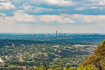 Elevated Panoramic view of Johannesburg - Northern View with  Sandton centre of horizon from Northcliff with white soft clouds 