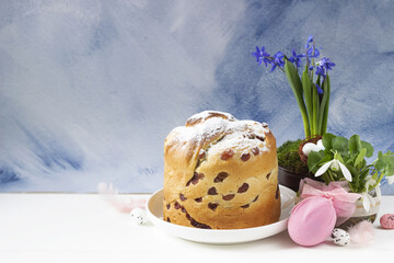 Easter background-easter cake Craffin  , easter egg and spring flowers, blue background. Easter banner