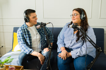 Latin podcast hosts recording a talk show episode