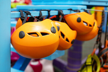 Orange Climbing Helmets on Display