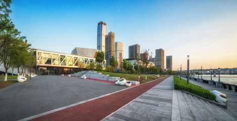 Contemporary Urban Park at Dawn with City Skyline View