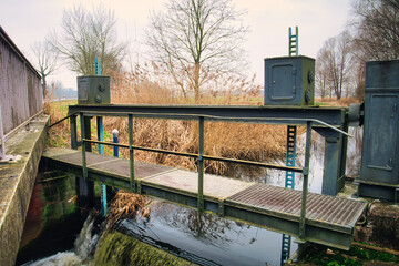 Canal - River - Landscape . Concept -Background - Water - Flowing  - Fluss - Kanal - Schleuse - Damm - Weir - obrazy, fototapety, plakaty