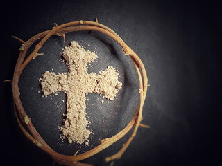 Lent Season, Holy Week and Good Friday Concepts. Crown of thorns with ash cross in dark background. Stock photo - obrazy, fototapety, plakaty