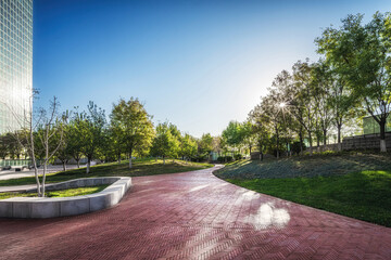 Peaceful Urban Park with Curved Pathway and City View