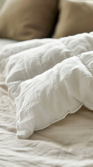 Fototapeta na wymiar Soft White Duvet Turned Down on a Cozy Bed with Neutral Pillows