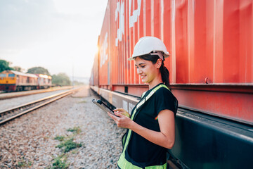 Portrait of woman engineer railway standing and looking camera in train factory. Maintenance cycle concept.