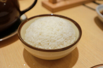 White steamed rice in round bowl
