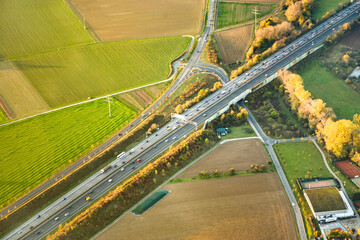 rural landscape with fields and highway from hot air balloon - obrazy, fototapety, plakaty
