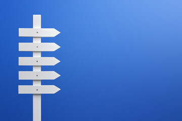 Wooden signpost on a blue background. Copy space.