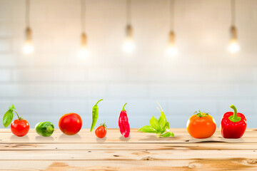 Fresh vegetables on a wooden table in front of a blurred background. Vegetarian and vegan concept.