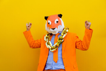 Cool man wearing colorful stylish suit with 3d origami animal funny mask on isolated colored background - Powered by Adobe