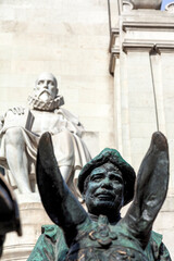 Sancho Panza, on his donkey, and Miguel de Cervantes at the background, the famous statue at Plaza de Espana of Madrid, Spain. 