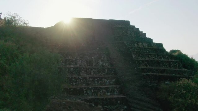 Purepecha Piramid in Mexico, the drone fly over the mountain at sunrice to reveal the piramid