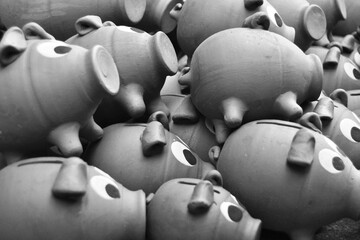 piggy bank pigs piled up on the floor at craft fair