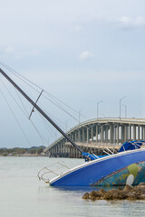 Small sailboat stranded on Biscayne Beach near Miami, Florida, USA