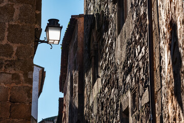 Ancient stone facades in the medieval town of Caceres, Spain.