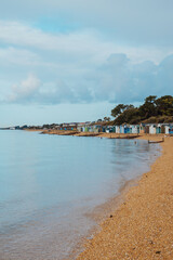 Fototapeta premium Beach huts on the beach along the Coast of England