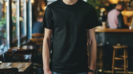 Young Model Shirt Mockup, man wearing black t-shirt in coffee shop in daylight, Shirt Mockup Template on hipster adult for design print, Male guy wearing casual t-shirt mockup placement