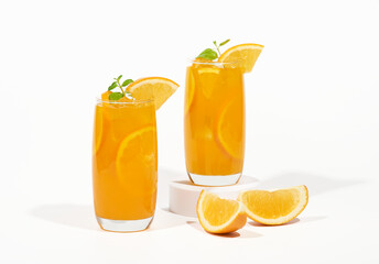 Glass of 100% Orange juice with orange slices fruits isolated on white background. cooling beverage summer drink