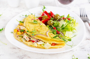 Healthy breakfast.Quesadilla with omelette, chicken fillet, corn and fresh salad. Keto, ketogenic lunch.