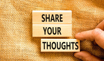 Share your thoughts symbol. Concept words Share your thoughts on beautiful wooden blocks. Beautiful canvas table canvas background. Businessman hand. Business share your thoughts concept. Copy space.