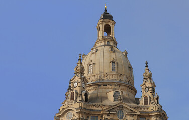 Fototapeta na wymiar Dome of the high baroque Lutheran Frauenkirche (Church of Our Lady) in Dresden, Saxony, Germany with blue sky on a summer evening