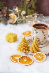 Beeswax spruce shaped candles on dark background