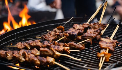 A grill with skewered meat on it