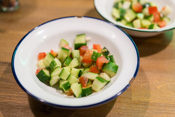 Fresh cucumber salad in the dish