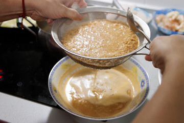 Fish in sauce with shrimp. Step by step preparation. Straining the fumet