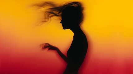 Female blurred silhouette on a orange background. Elegant outline of a woman in motion out of focus