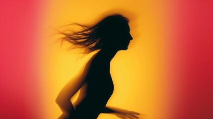 Female blurred silhouette on a orange background. Elegant outline of a woman in motion out of focus