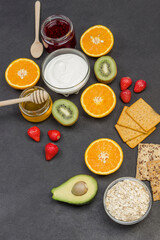 Oatmeal, avocado berries, fruits, jam, yogurt for Energy Healthy breakfast